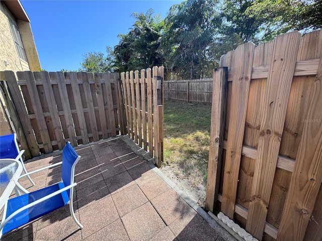 view of patio / terrace featuring fence