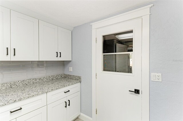 interior space featuring baseboards