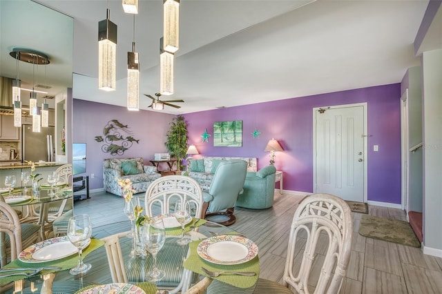 dining area featuring baseboards, ceiling fan, and wood finish floors
