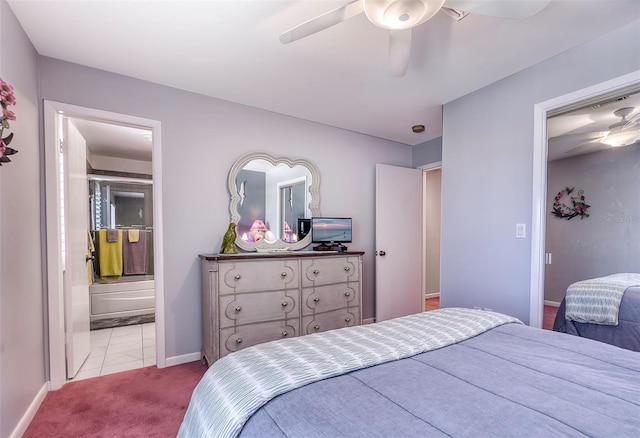 carpeted bedroom featuring a ceiling fan, baseboards, and ensuite bathroom