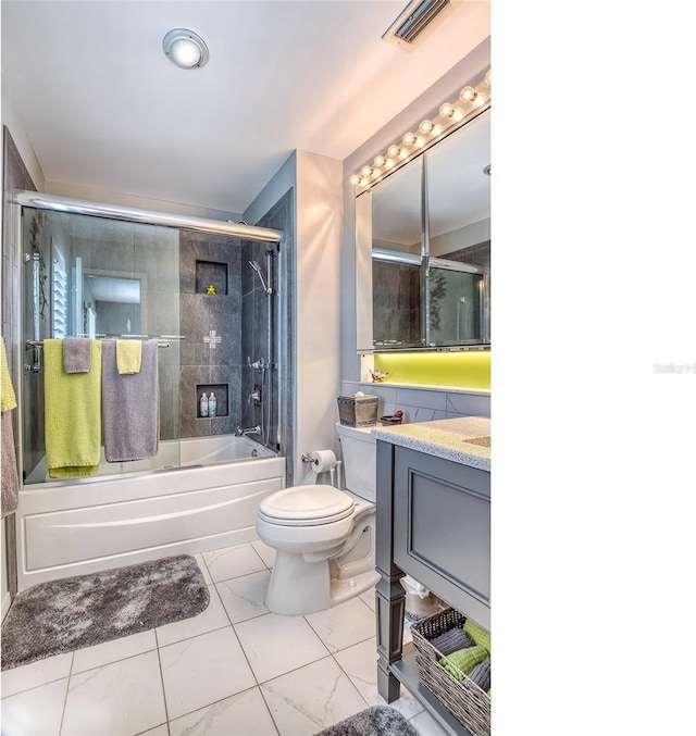 full bath featuring vanity, bath / shower combo with glass door, toilet, and visible vents