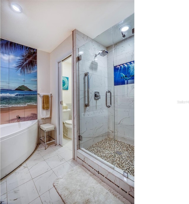 bathroom with toilet, marble finish floor, recessed lighting, a bath, and a stall shower