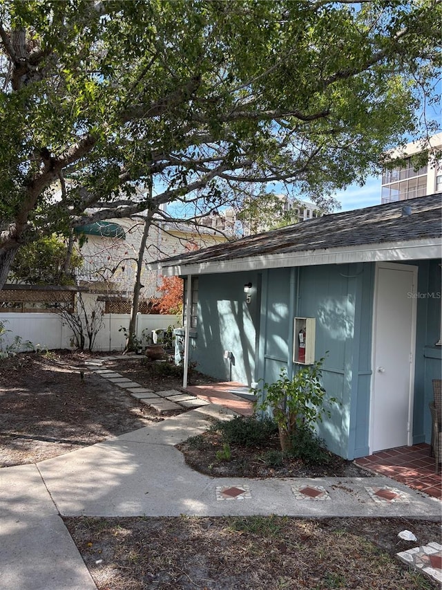 170 Roosevelt Dr Unit 5, Sarasota, FL 34236 - exterior space with an outbuilding, a shed, and roof with shingles