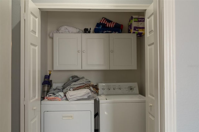 3784 Parkridge Cir Unit 22-203, Sarasota, FL 34243 - washroom featuring cabinet space and washing machine and clothes dryer