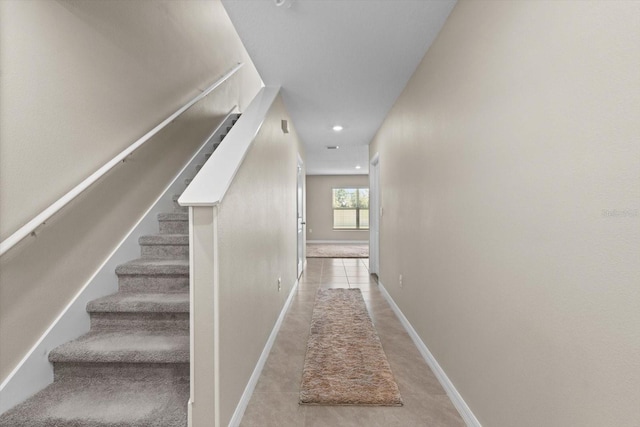 6314 Distant Haze Pl, Palmetto, FL 34221 - stairway with baseboards, tile patterned flooring, and recessed lighting