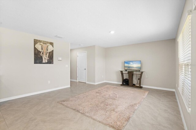6314 Distant Haze Pl, Palmetto, FL 34221 - unfurnished living room featuring baseboards