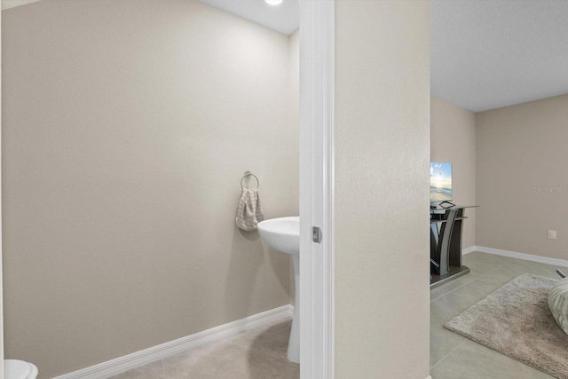 6314 Distant Haze Pl, Palmetto, FL 34221 - bathroom featuring tile patterned floors and baseboards