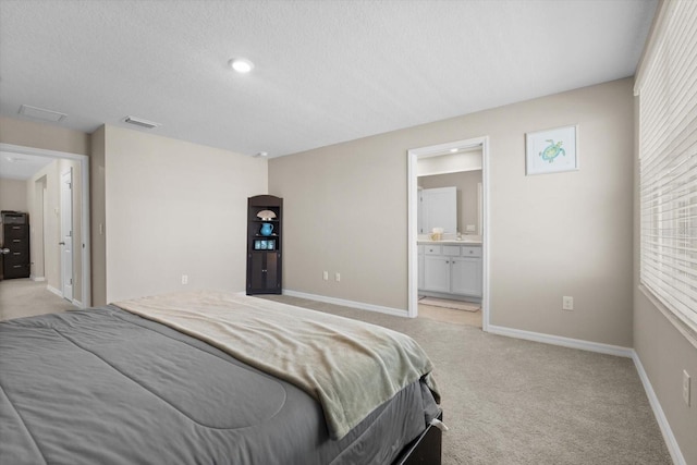 6314 Distant Haze Pl, Palmetto, FL 34221 - bedroom with light carpet, a textured ceiling, baseboards, and ensuite bathroom