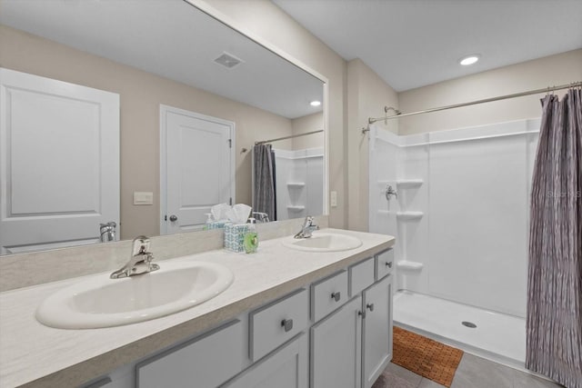 6314 Distant Haze Pl, Palmetto, FL 34221 - bathroom featuring double vanity, a shower with shower curtain, and tile patterned floors