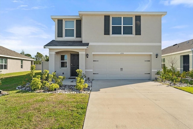 6314 Distant Haze Pl, Palmetto, FL 34221 - traditional-style house with stucco siding, driveway, a front yard, and a garage
