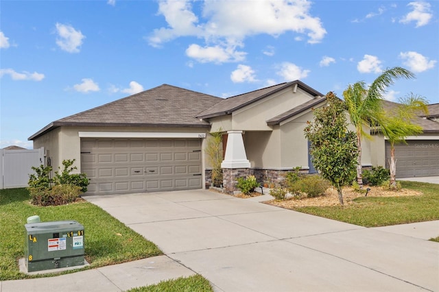 ranch-style home with stucco siding, an attached garage, driveway, and stone siding