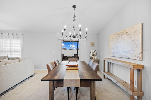 dining room featuring baseboards, light tile patterned flooring, and a notable chandelier
