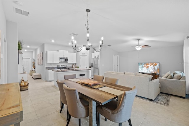dining room with light tile patterned floors, ceiling fan with notable chandelier, recessed lighting, and visible vents