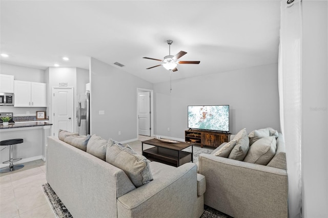 living area with visible vents, lofted ceiling, recessed lighting, a ceiling fan, and light tile patterned floors