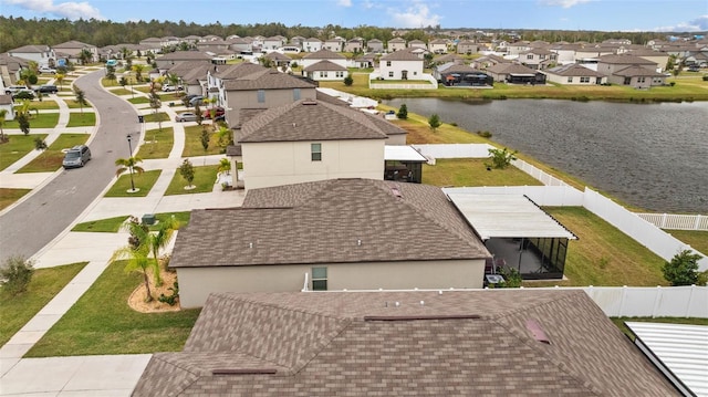 aerial view with a water view and a residential view