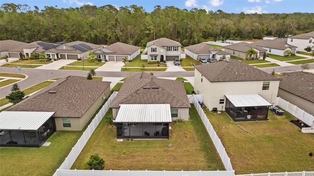 birds eye view of property with a residential view