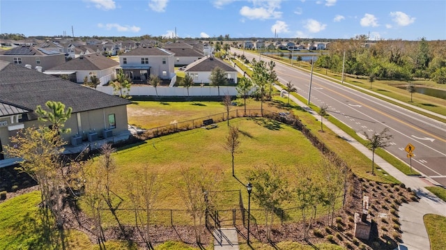 birds eye view of property with a residential view