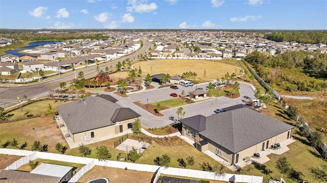 birds eye view of property with a residential view