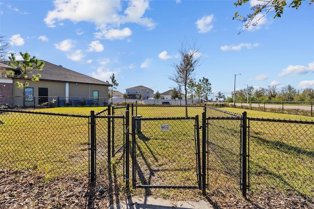 view of yard featuring fence and a gate