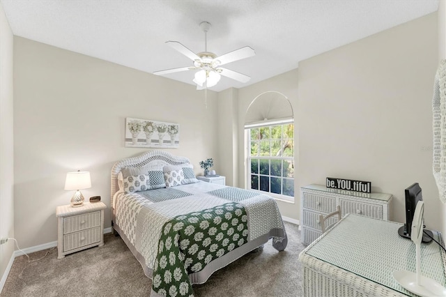 bedroom featuring a ceiling fan, baseboards, and carpet