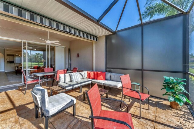 view of patio with a lanai and a ceiling fan