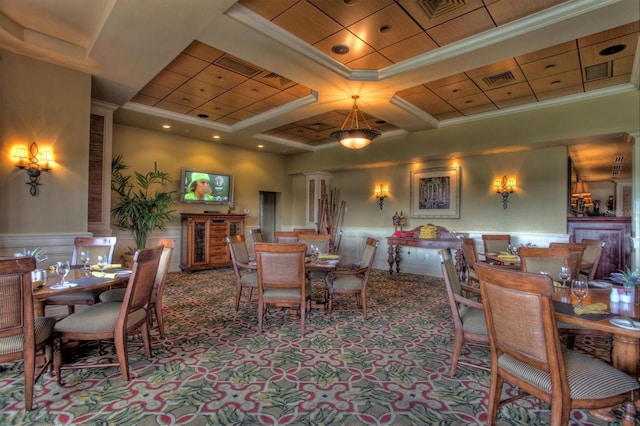 dining area with crown molding, carpet floors, wainscoting, and visible vents