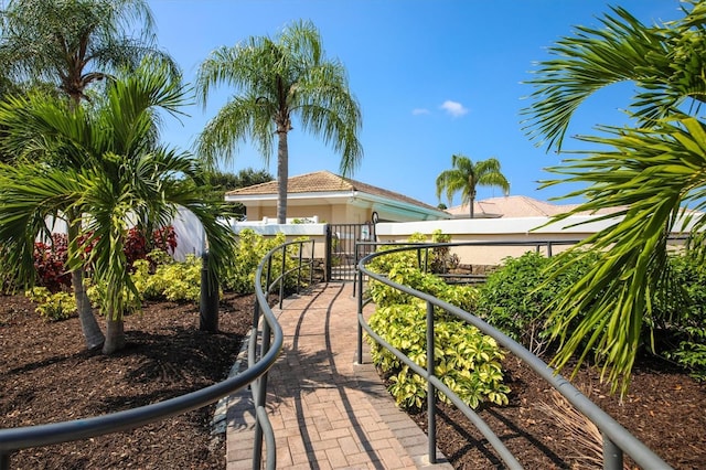 view of property's community with a gate and fence