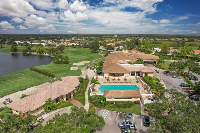 birds eye view of property featuring a water view, golf course view, and a residential view