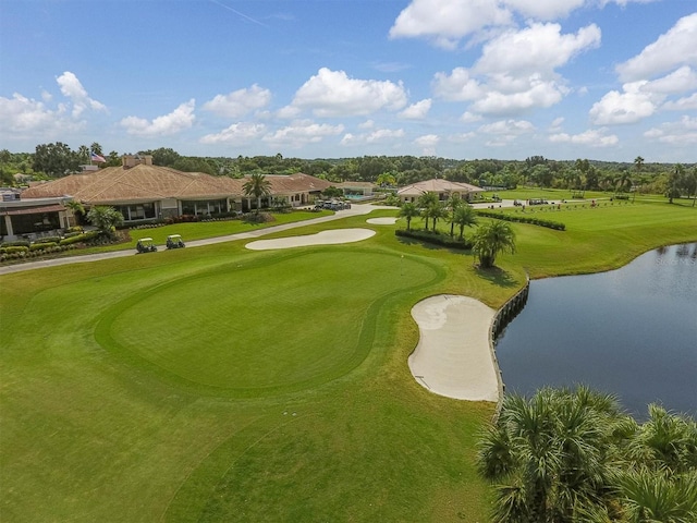 surrounding community with a water view and golf course view