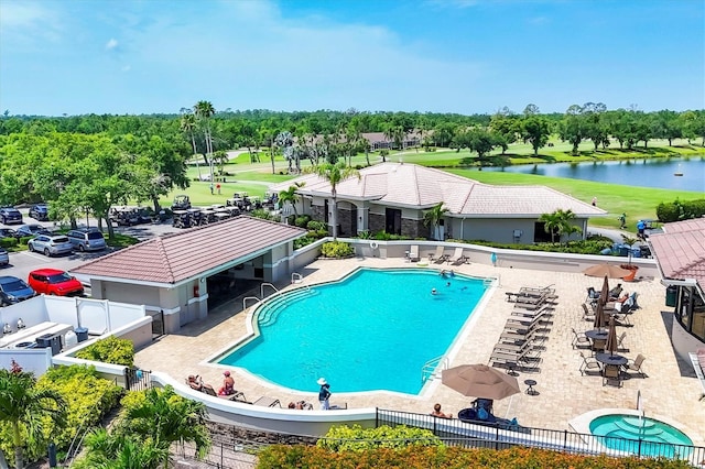 5217 Chase Oaks Dr, Sarasota, FL 34241 - community pool featuring fence, view of wooded area, a water view, and a patio area