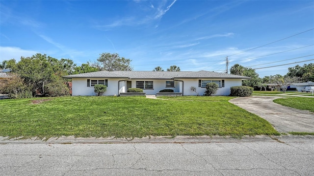 2702 Bedford Way, Sarasota, FL 34239 - ranch-style house featuring stucco siding, concrete driveway, and a front yard