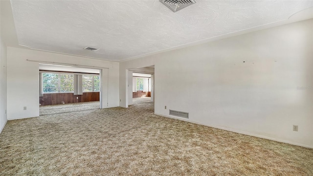 2702 Bedford Way, Sarasota, FL 34239 - unfurnished room featuring carpet flooring, a textured ceiling, and visible vents