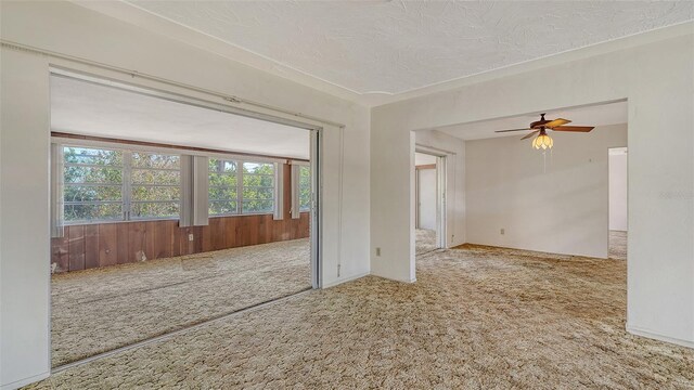 2702 Bedford Way, Sarasota, FL 34239 - empty room featuring carpet floors, a textured ceiling, and ceiling fan