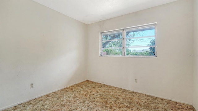 2702 Bedford Way, Sarasota, FL 34239 - carpeted empty room featuring baseboards