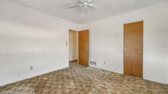 2702 Bedford Way, Sarasota, FL 34239 - spare room featuring visible vents, carpet flooring, baseboards, and a ceiling fan