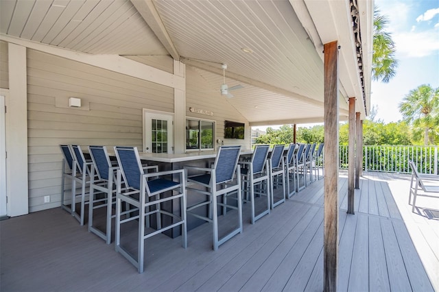 wooden deck with a ceiling fan