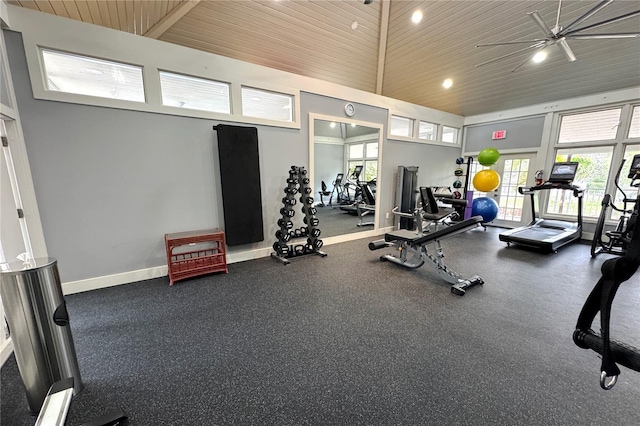 gym with wooden ceiling, healthy amount of natural light, ceiling fan, baseboards, and lofted ceiling