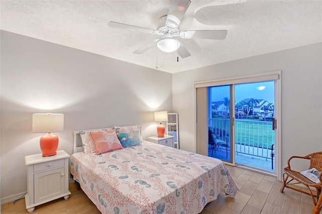 bedroom with access to exterior, light wood-style floors, a ceiling fan, and baseboards