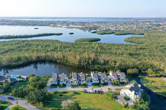 aerial overview of property's location with a large body of water and nearby suburban area