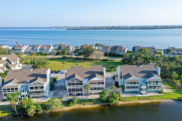 aerial perspective of suburban area featuring a nearby body of water