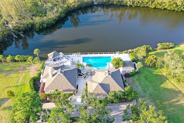 view of subject property featuring a pool and a large body of water