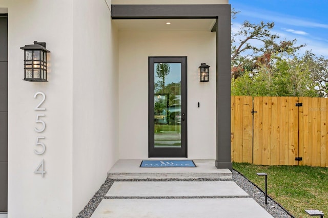 2554 Arlington St, Sarasota, FL 34239 - property entrance with fence and stucco siding