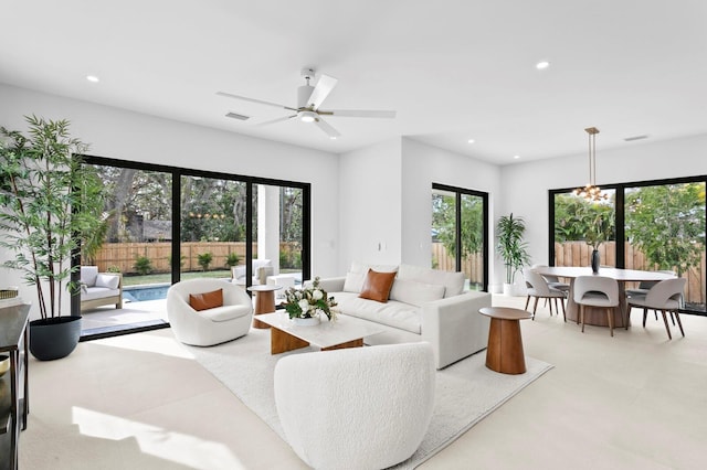 2554 Arlington St, Sarasota, FL 34239 - living room with recessed lighting, visible vents, and ceiling fan with notable chandelier