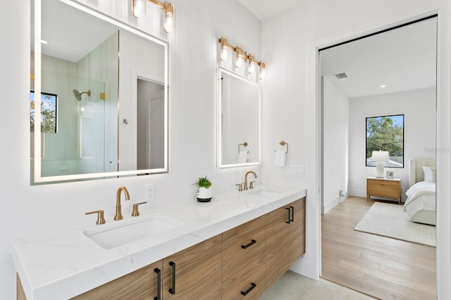 2554 Arlington St, Sarasota, FL 34239 - ensuite bathroom featuring visible vents, a sink, a walk in shower, and double vanity
