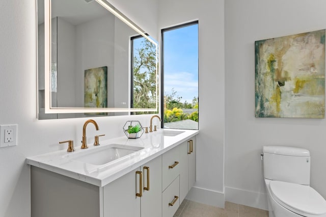 2554 Arlington St, Sarasota, FL 34239 - bathroom featuring a sink, tile patterned floors, toilet, and double vanity