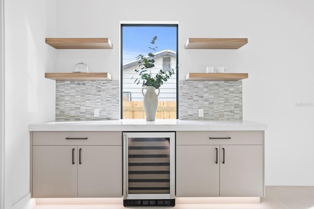 2554 Arlington St, Sarasota, FL 34239 - bar with wine cooler, a dry bar, and backsplash
