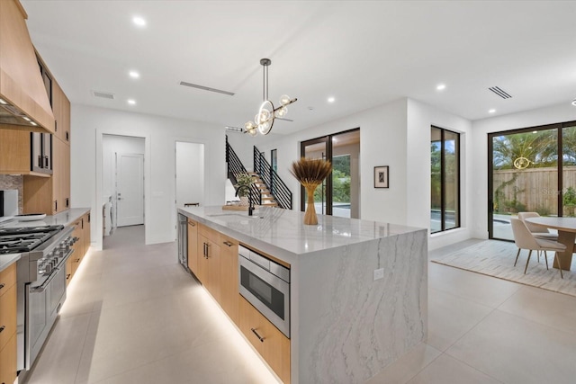 1559 Bay Rd, Sarasota, FL 34239 - kitchen with a large island, visible vents, appliances with stainless steel finishes, modern cabinets, and an inviting chandelier