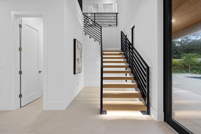 1559 Bay Rd, Sarasota, FL 34239 - staircase featuring baseboards