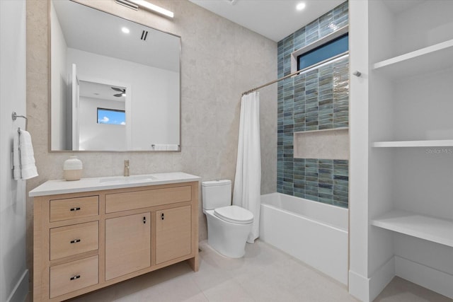 1559 Bay Rd, Sarasota, FL 34239 - bathroom featuring shower / bath combination with curtain, tile walls, tile patterned flooring, vanity, and toilet