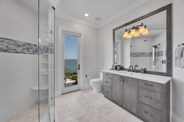 bathroom with toilet, a tile shower, visible vents, vanity, and ornamental molding